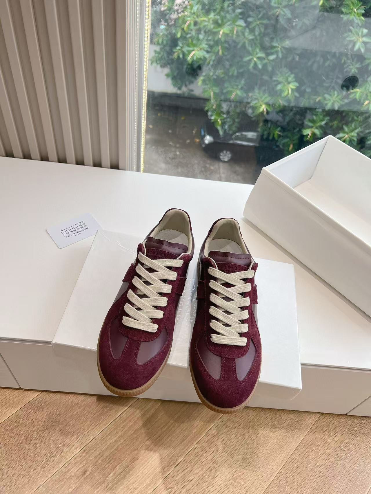 ua ma*s*n Ma*i*la mm6 sneakers