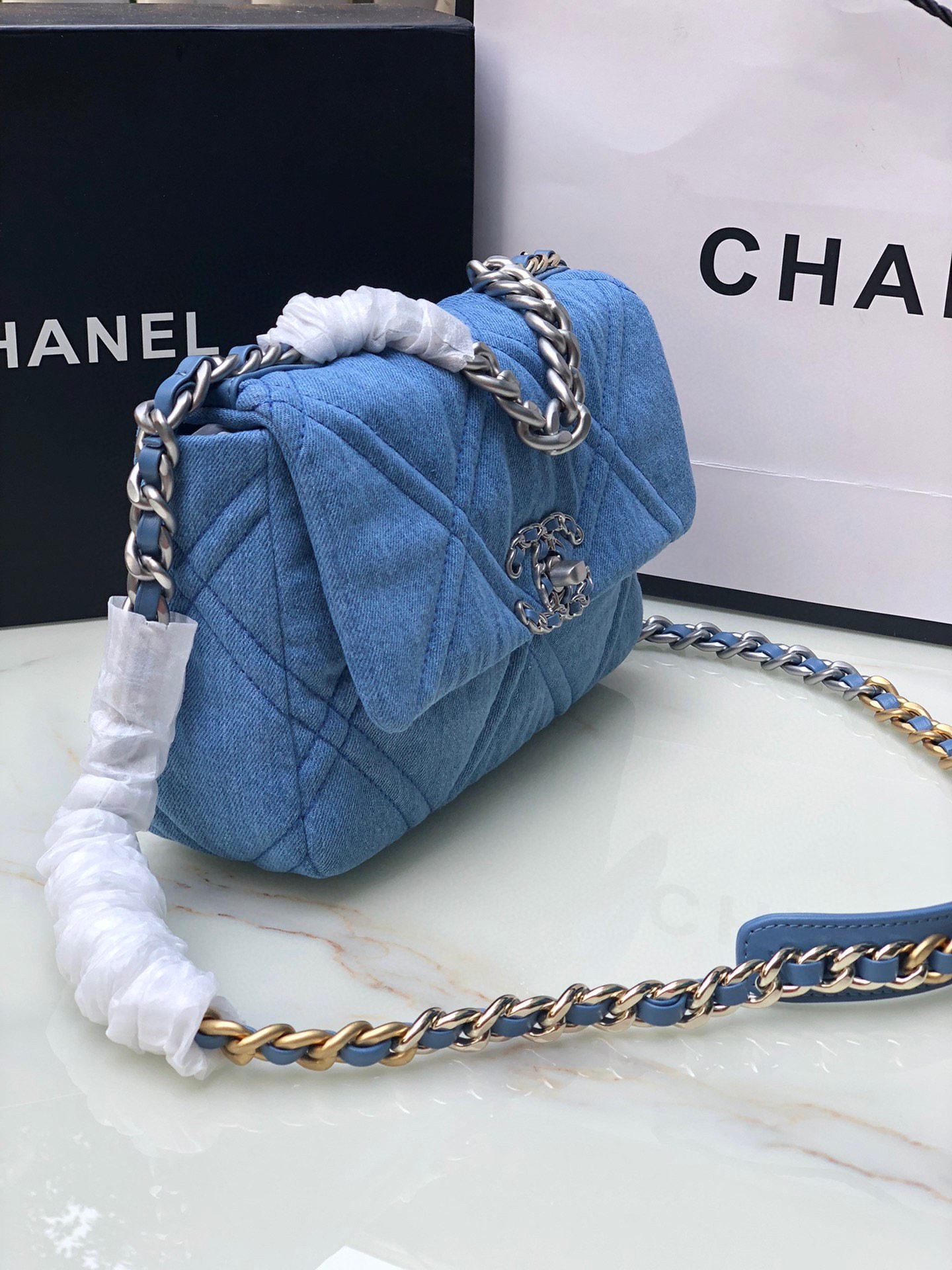 Ch*el 19 handbag, gold-tone, silver-tone & ruthenium-finish metal blue 6.2 × 10.1 × 3.5 in