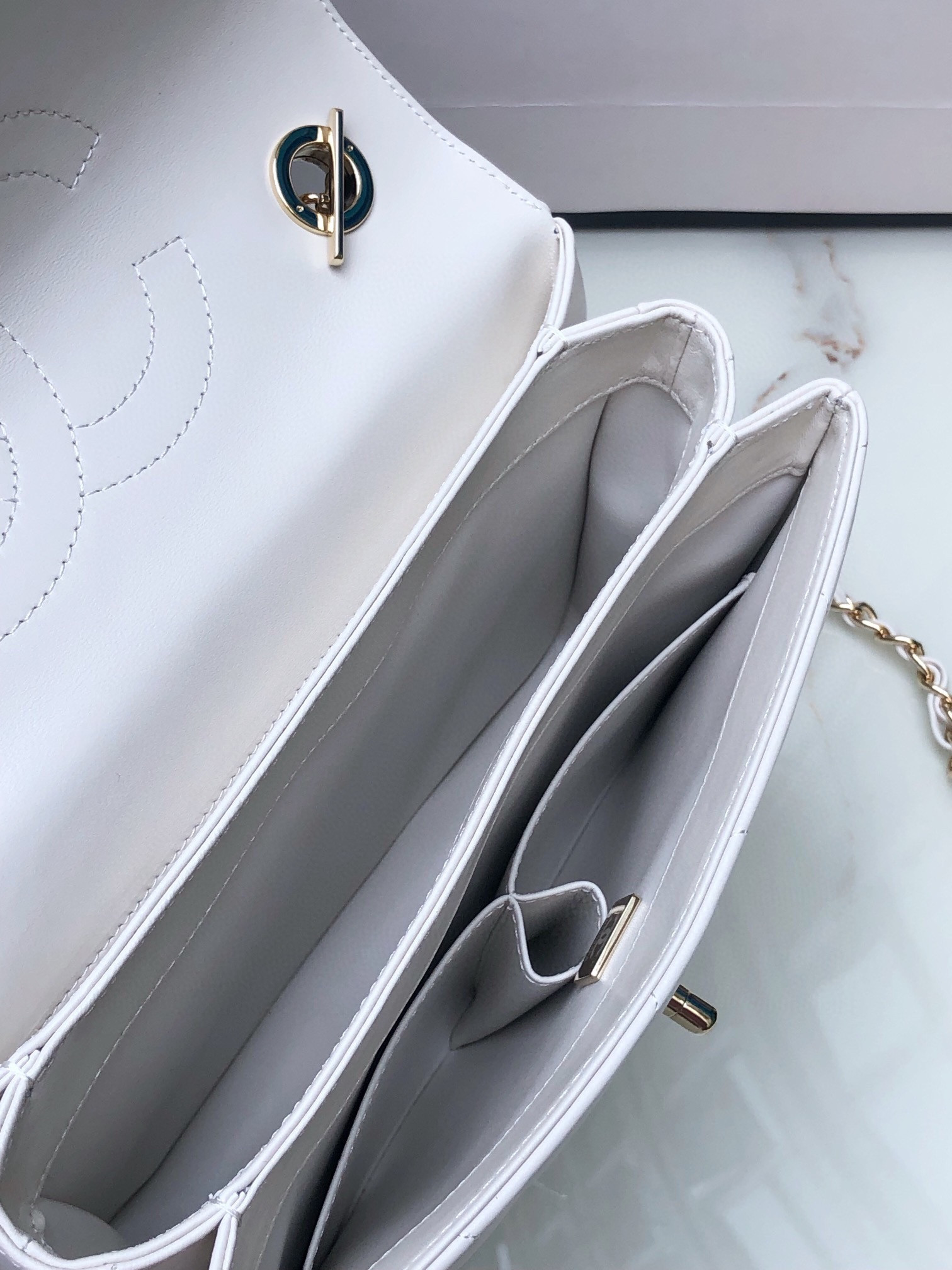 Ch*el flap bag with top handle 6.6 × 9.8 × 4.7 in