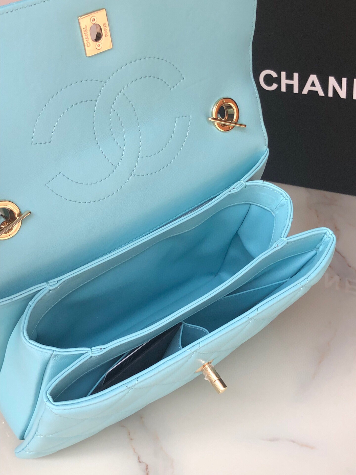 Ch*el flap bag with top handle 6.6 × 9.8 × 4.7 in