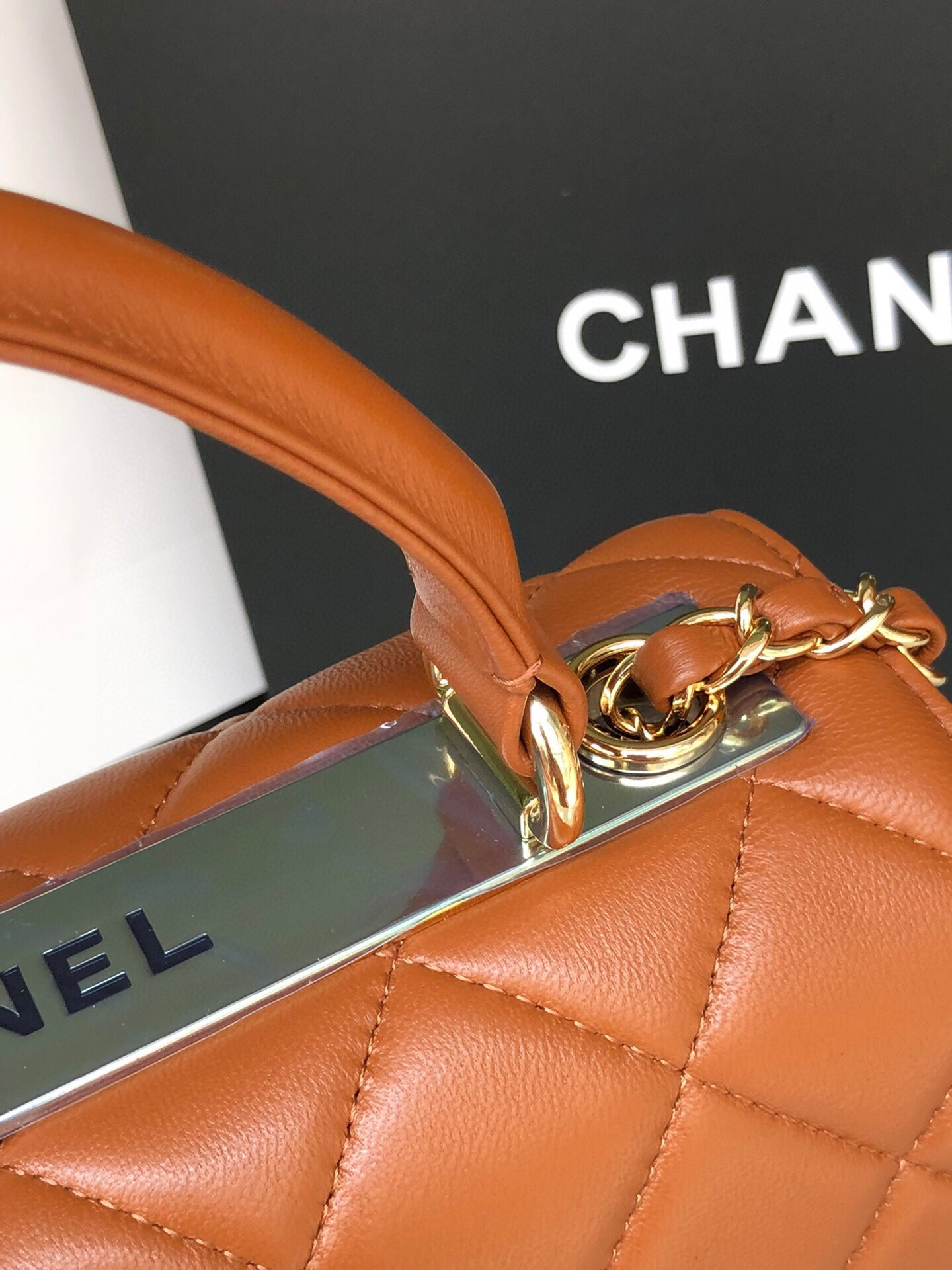 Ch*el flap bag with top handle 6.6 × 9.8 × 4.7 in