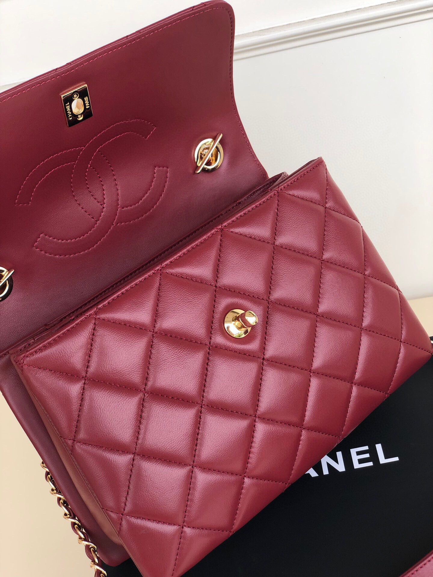 Ch*el flap bag with top handle 6.6 × 9.8 × 4.7 in